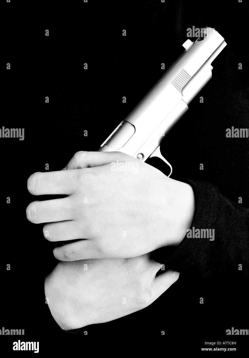 Caucasian female hands holding a gun Stock Photo Alamy