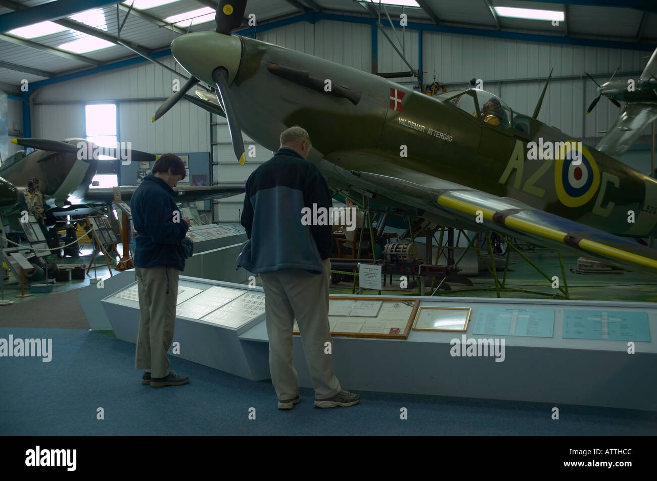 Visitors looking at replica of the Axel Svendsen Spitfire VB  BL294 Valdemar Atterdag, Tangmere Aviation Museum Stock Photo