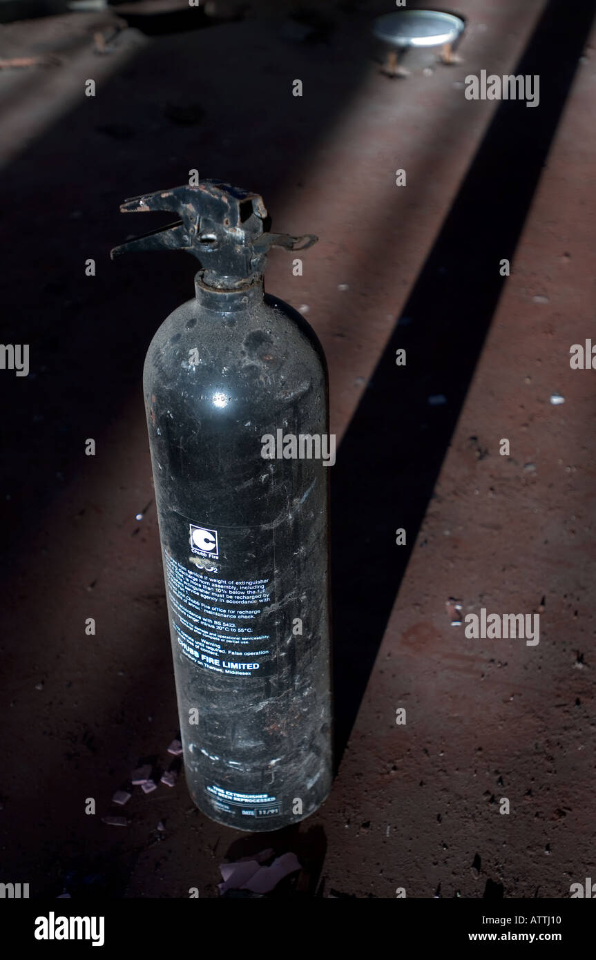 An old fire extinguisher in an Old abandoned cement factory in Shoreham