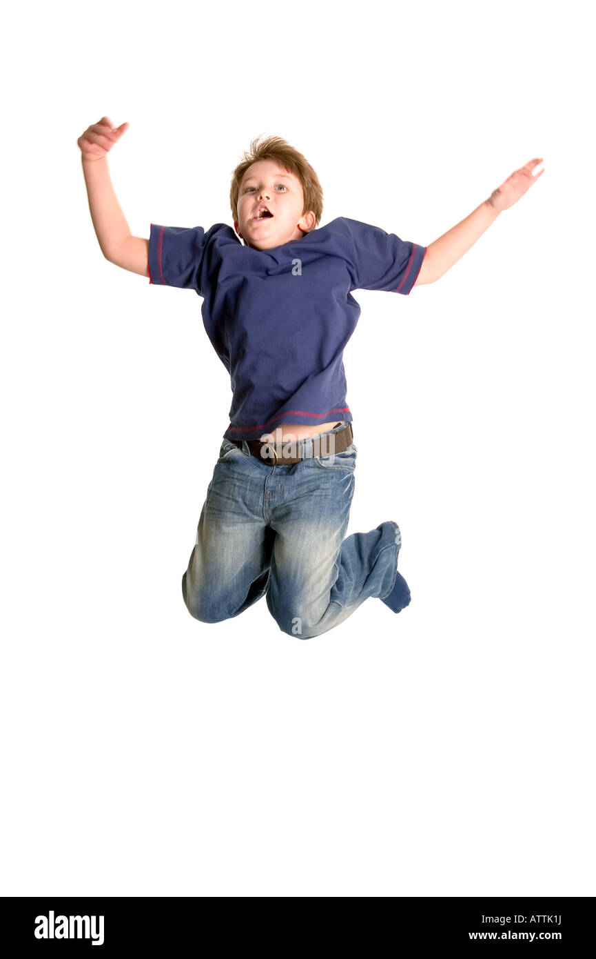 Young boy jumping in the air isolated on white motion blur Stock Photo
