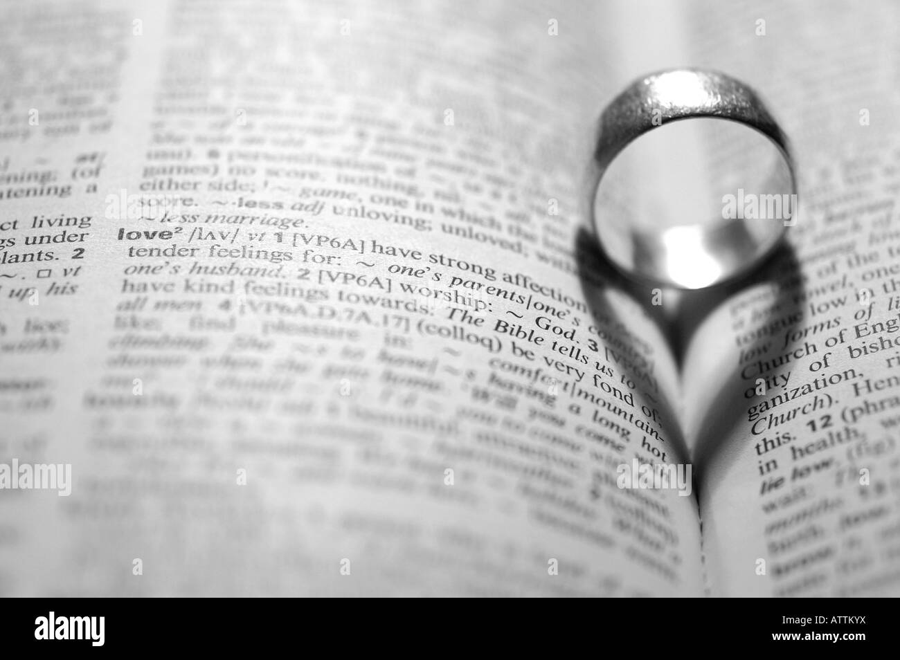 wedding ring casting a heart shaped shadow Stock Photo