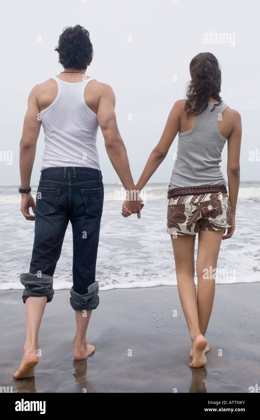 Teen couple walking holding hands hi-res stock photography and images ...