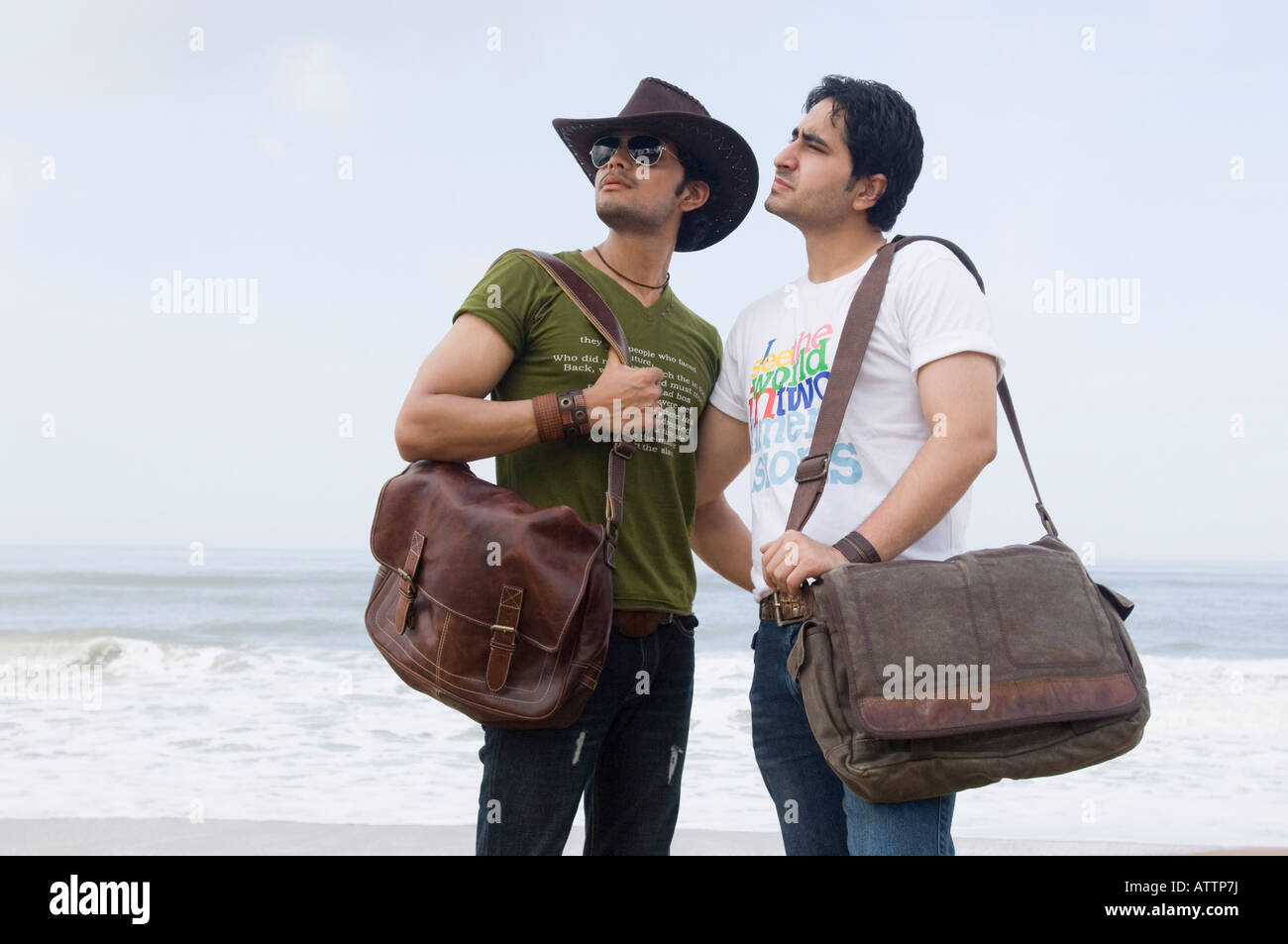 Three men with arms around each other hi-res stock photography and ...