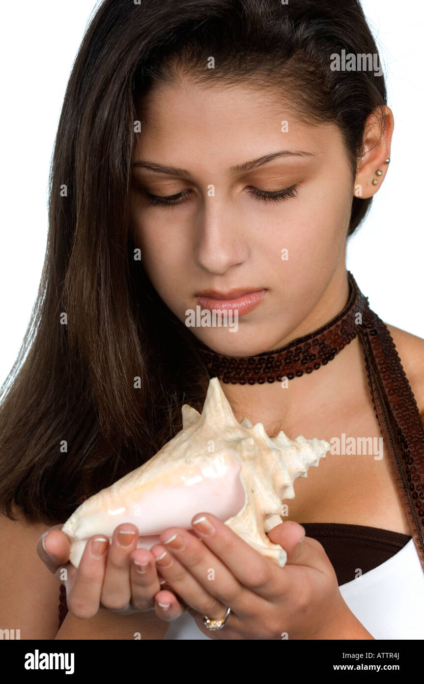 beautiful teenage girl holding a seashell Stock Photo