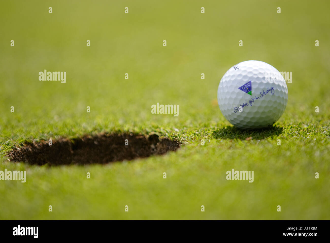 golf hole ball putting Stock Photo Alamy