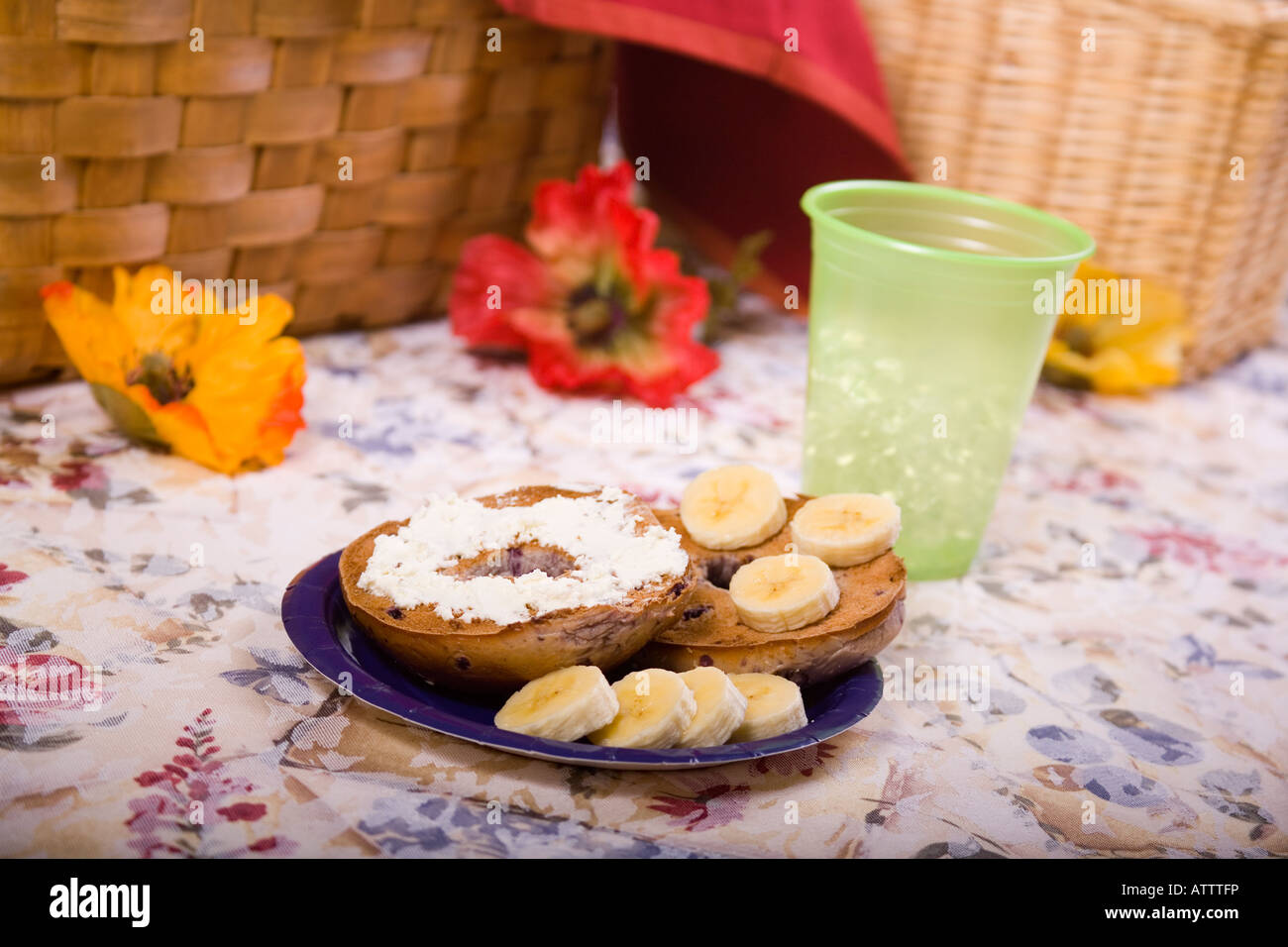 Blueberry Bagel with cream cheese and sliced bananas Stock Photo Alamy