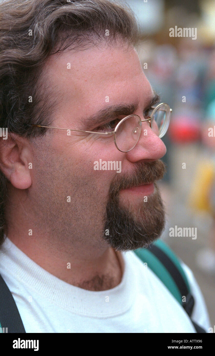 Bearded man age 27 looking happily into distance. Minnesota State Fair St Paul Minnesota USA Stock Photo