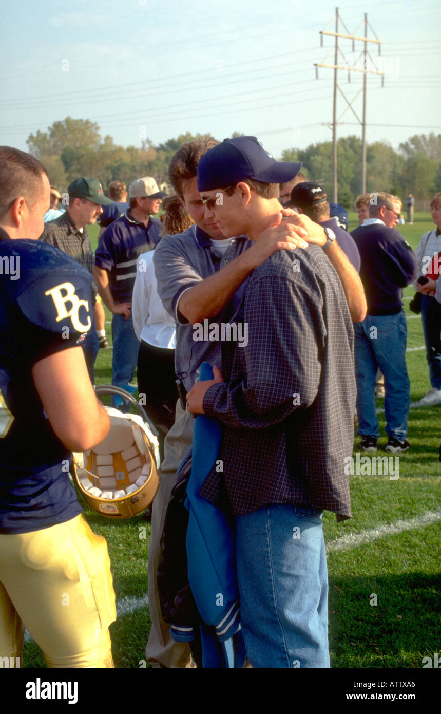 Men Age 35 And 21 Comforting Friend After Football Game St Paul Stock Photo Alamy