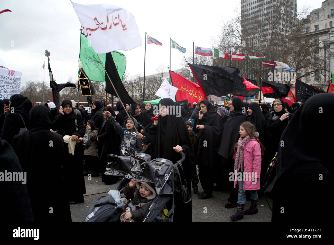 Muslim women and children marching in London in honour of Shia martyr Imam Hussain Stock Photo