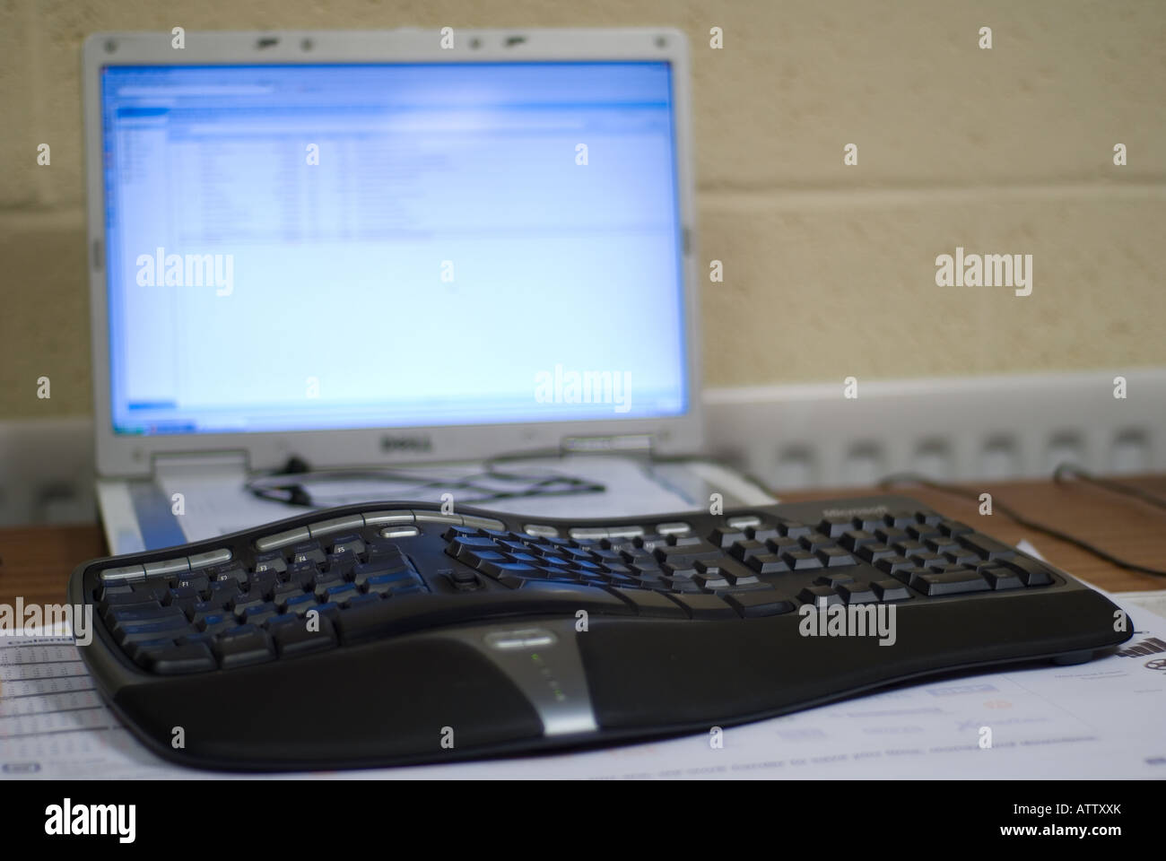 A laptop with an external ergonomic keyboard attached stock photo alamy