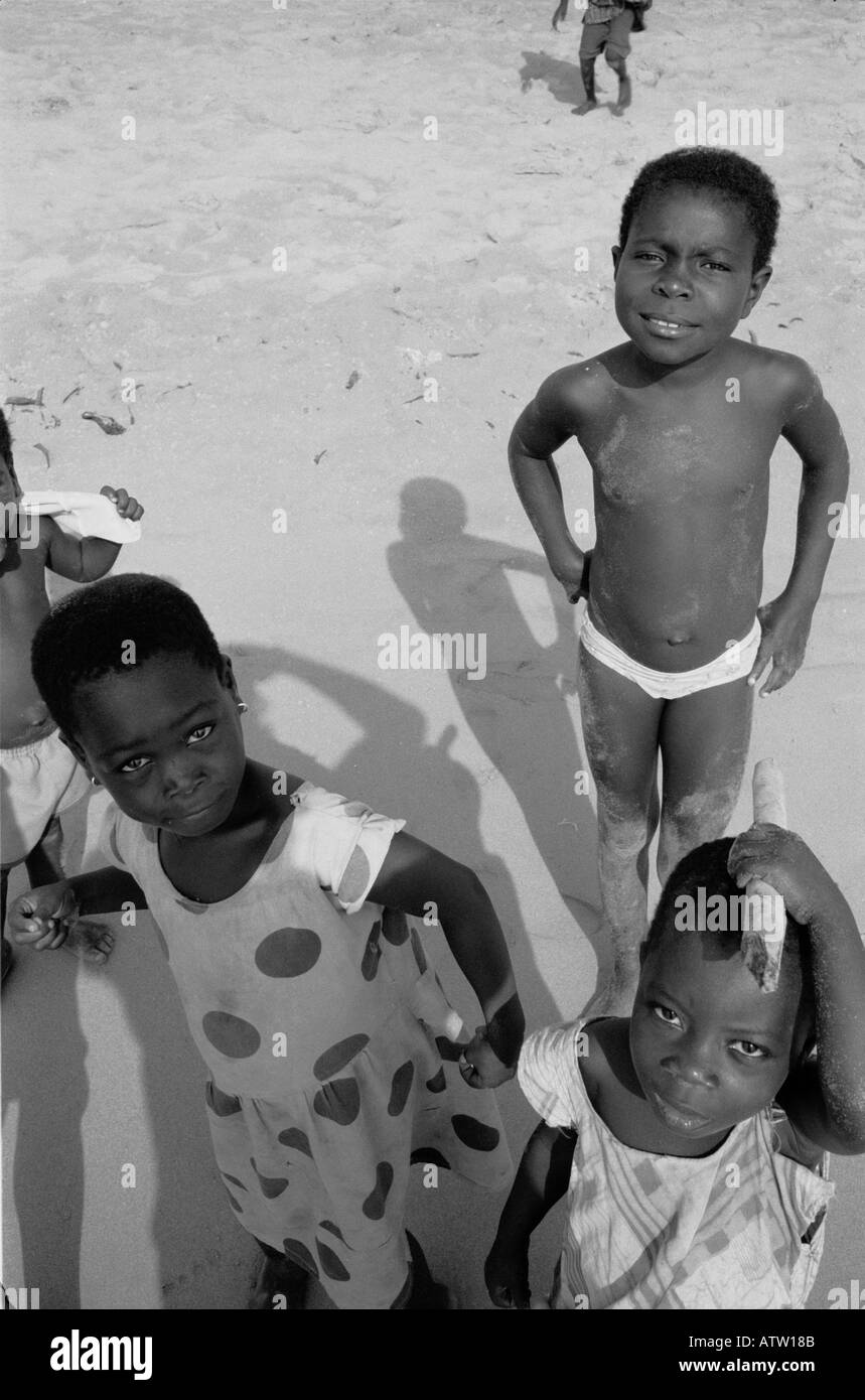 Three Kids on the beach at Busua Cape Coast Ghana West Africa Stock Photo