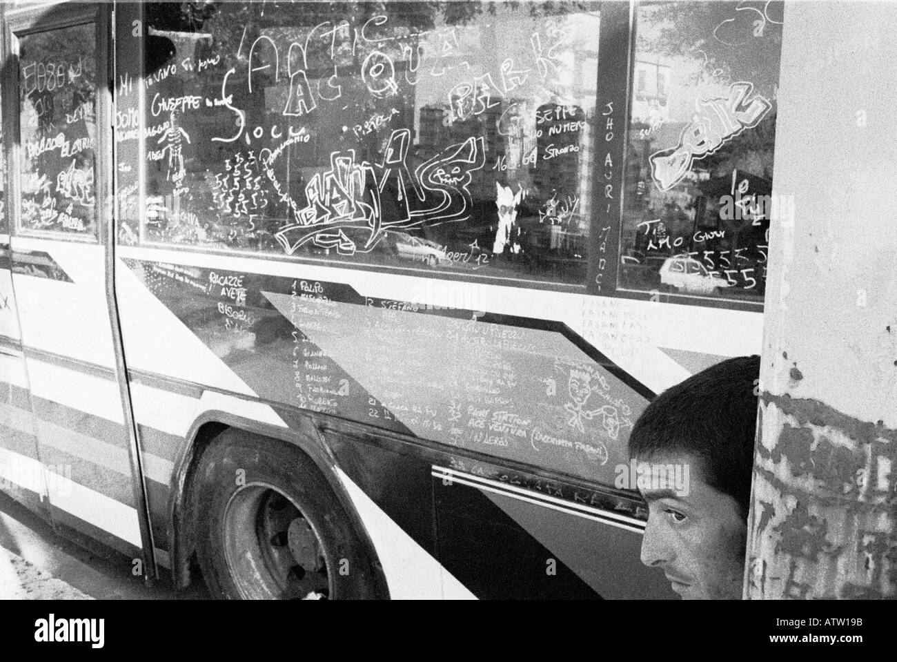 School Bus in Palermo Sicily with Graffiti and face in forground Stock Photo