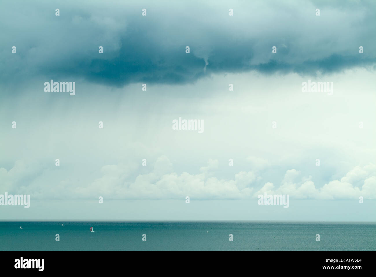 rain clouds gathering over the sea Stock Photo - Alamy