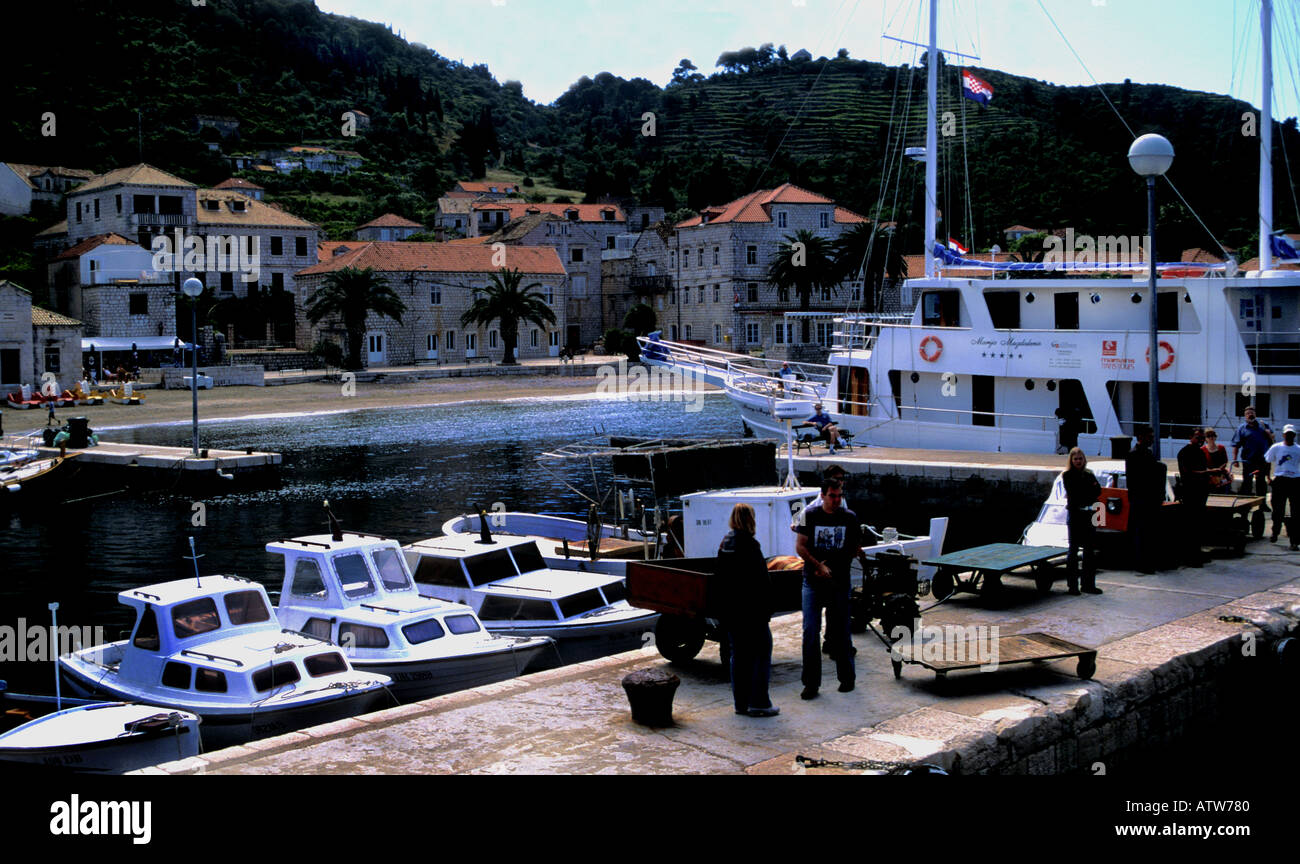 Locals waiting on the quay to unload the goods from the next ship in Lopud Elaphite Island Dalmatia Croatia Stock Photo