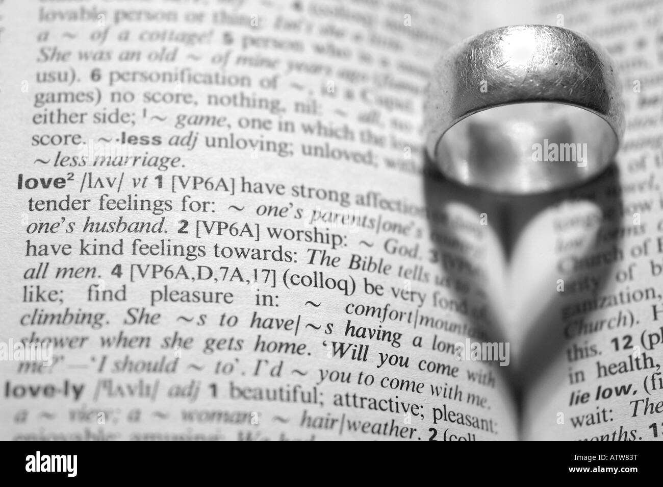 wedding ring casting a heart shaped shadow Stock Photo