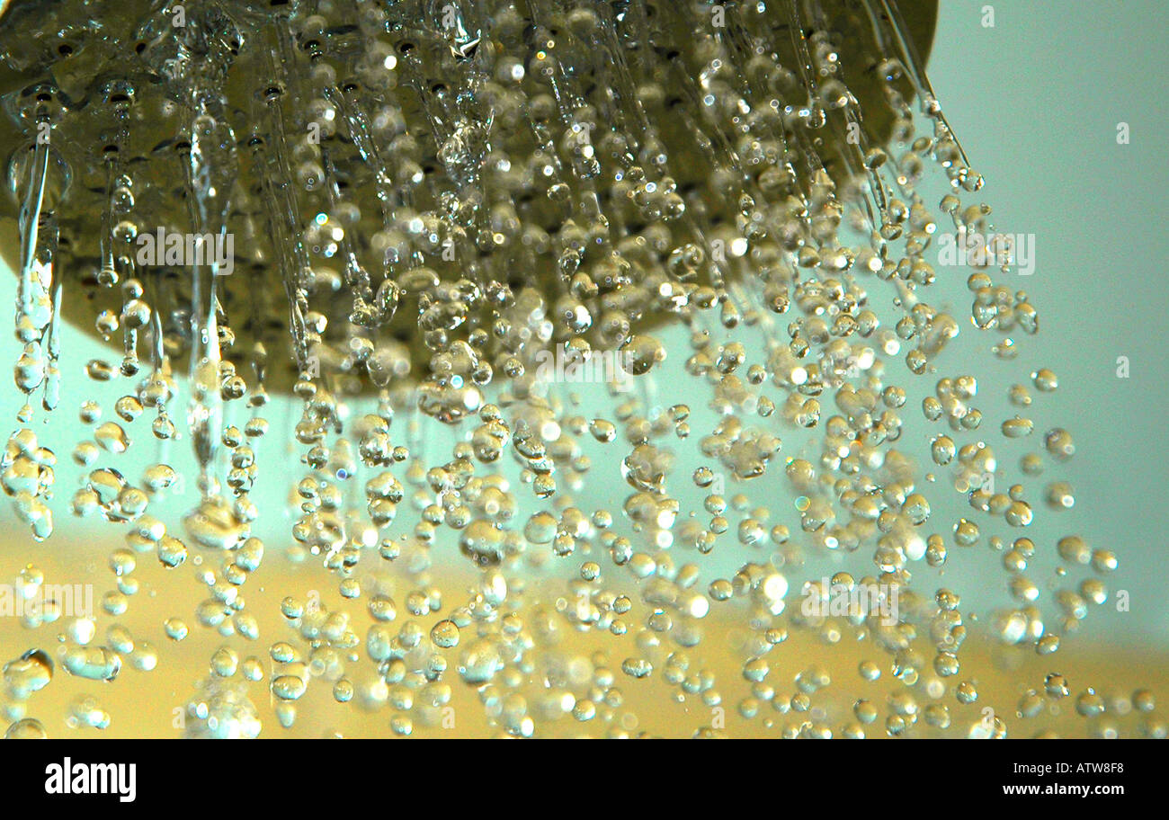 Chrome Showerhead Spraying Water Stock Photo