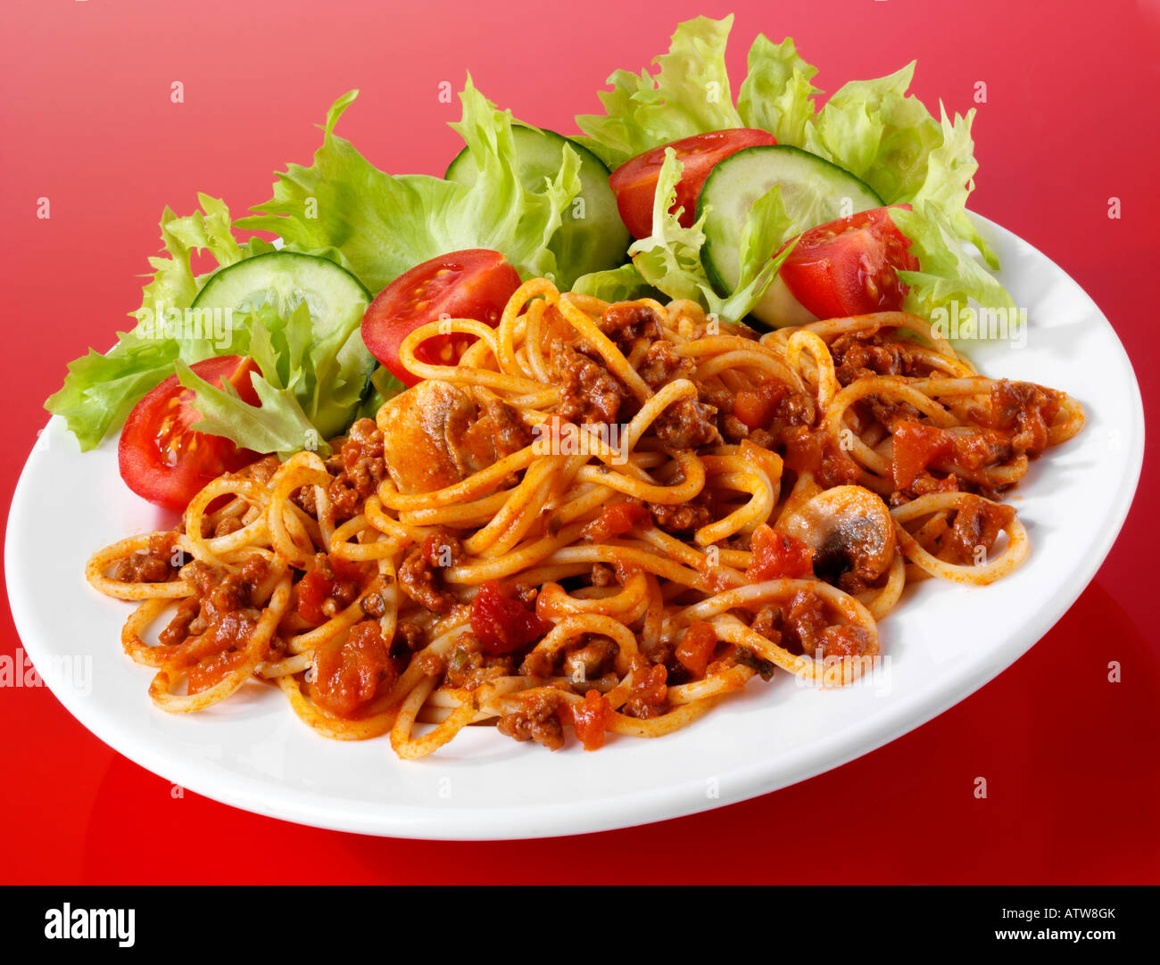 PLATE OF SPAGHETTI BOLOGNESE WITH SALAD Stock Photo - Alamy