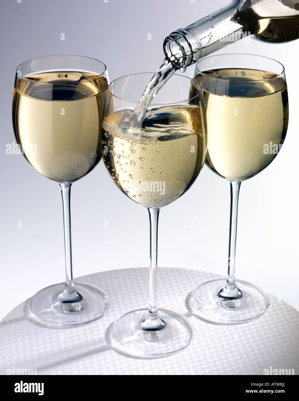 THREE GLASSES OF WHITE WINE Stock Photo - Alamy