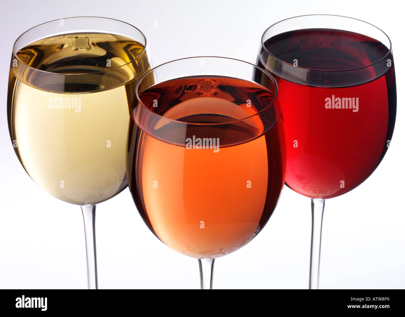 THREE GLASSES OF RED,WHITE AND ROSE WINE Stock Photo
