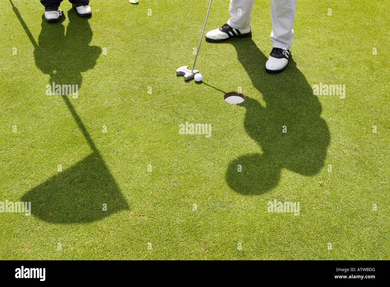 golf green putting flag shadow Stock Photo Alamy