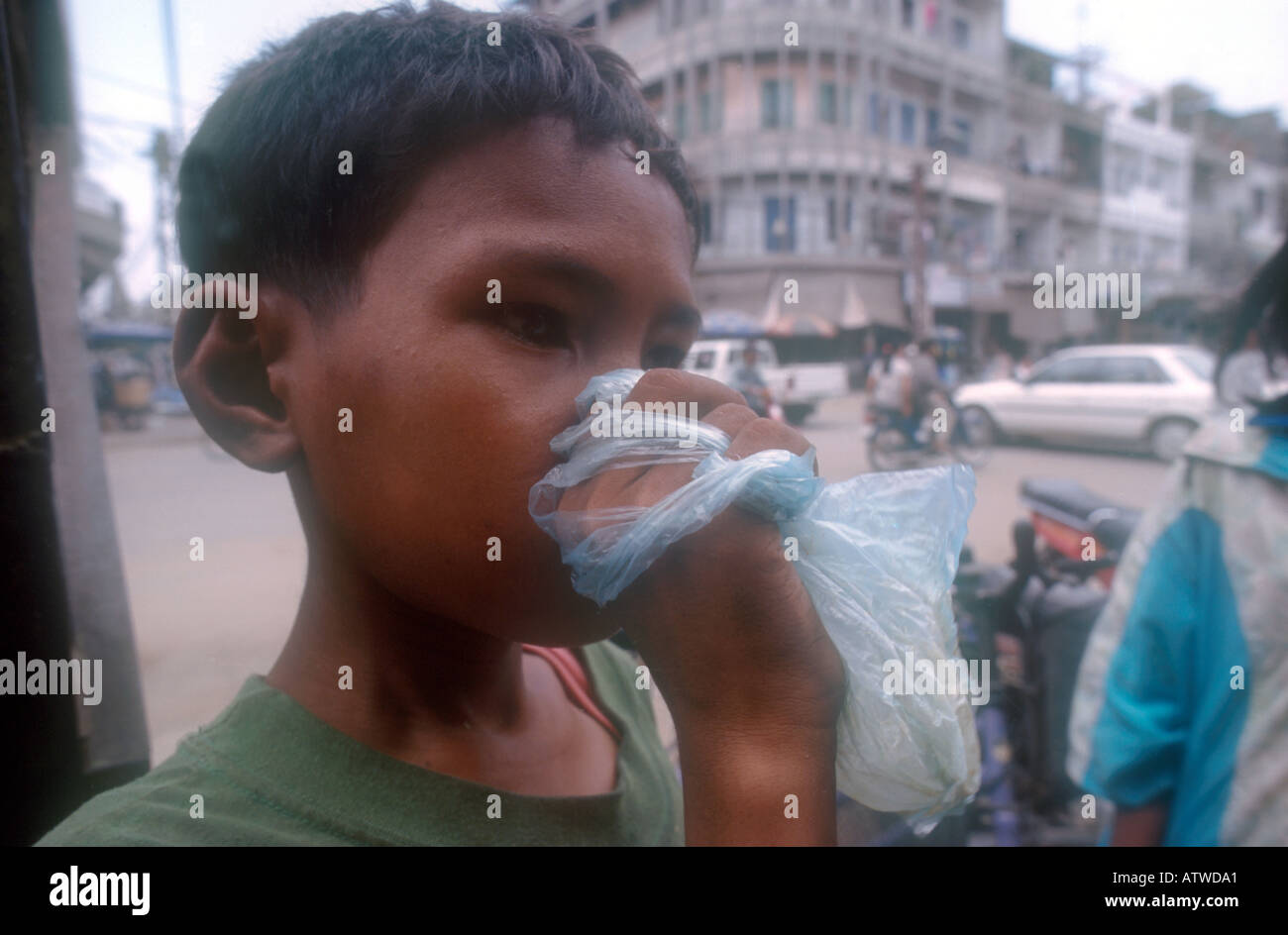 Street children sniffing glue in Phnom Penh Cambodia Stock Photo