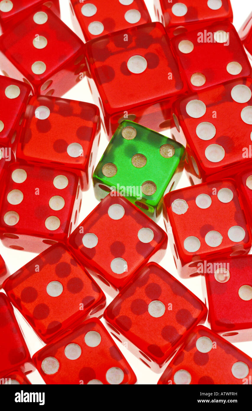 Red dice with one green one Stock Photo - Alamy