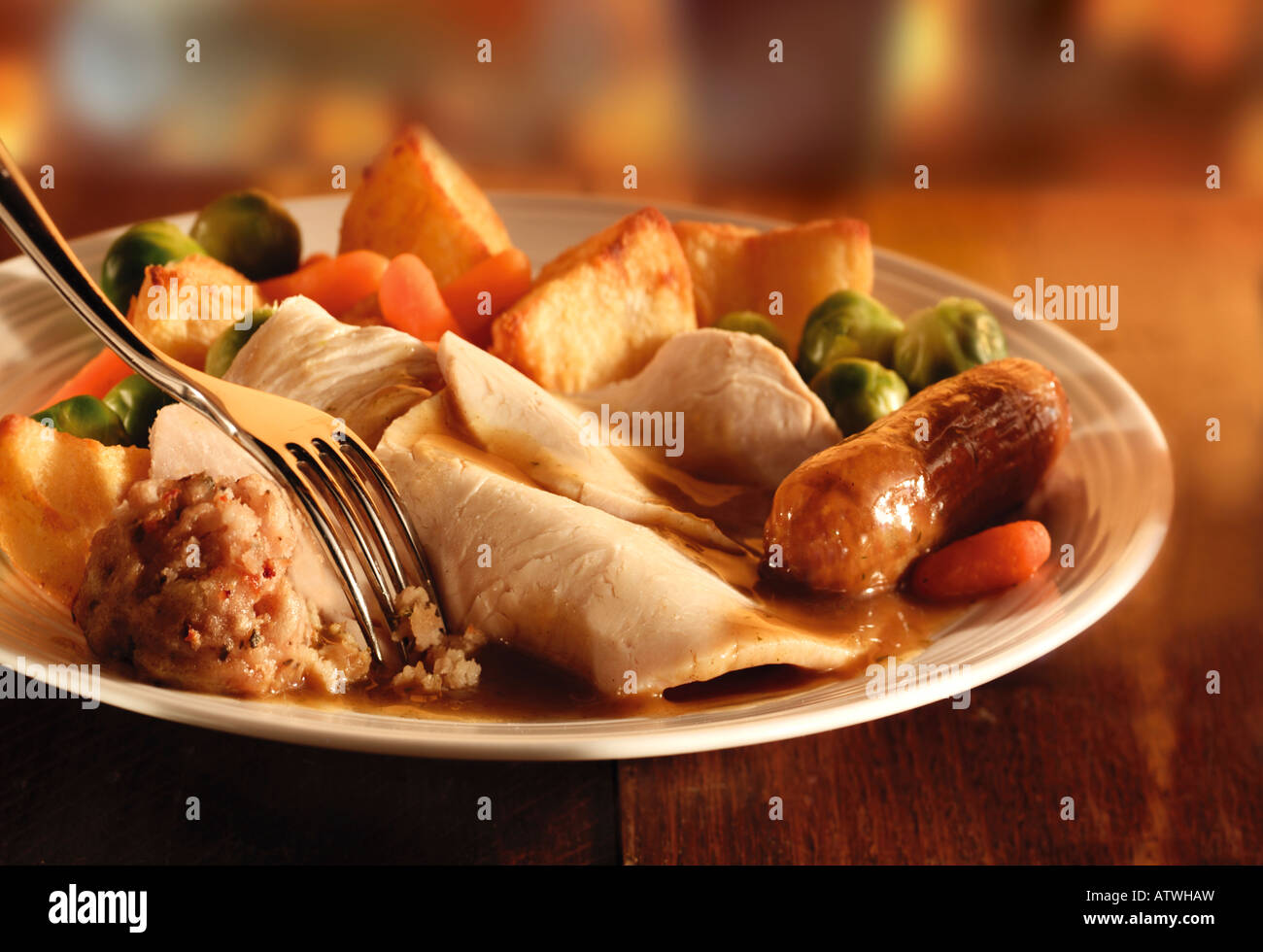 Traditional roast turkey dinner with roast potatoes and stuffing Stock Photo