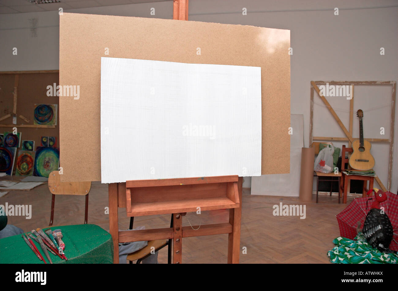 Wooden easel with white canvas in university classroom Stock Photo