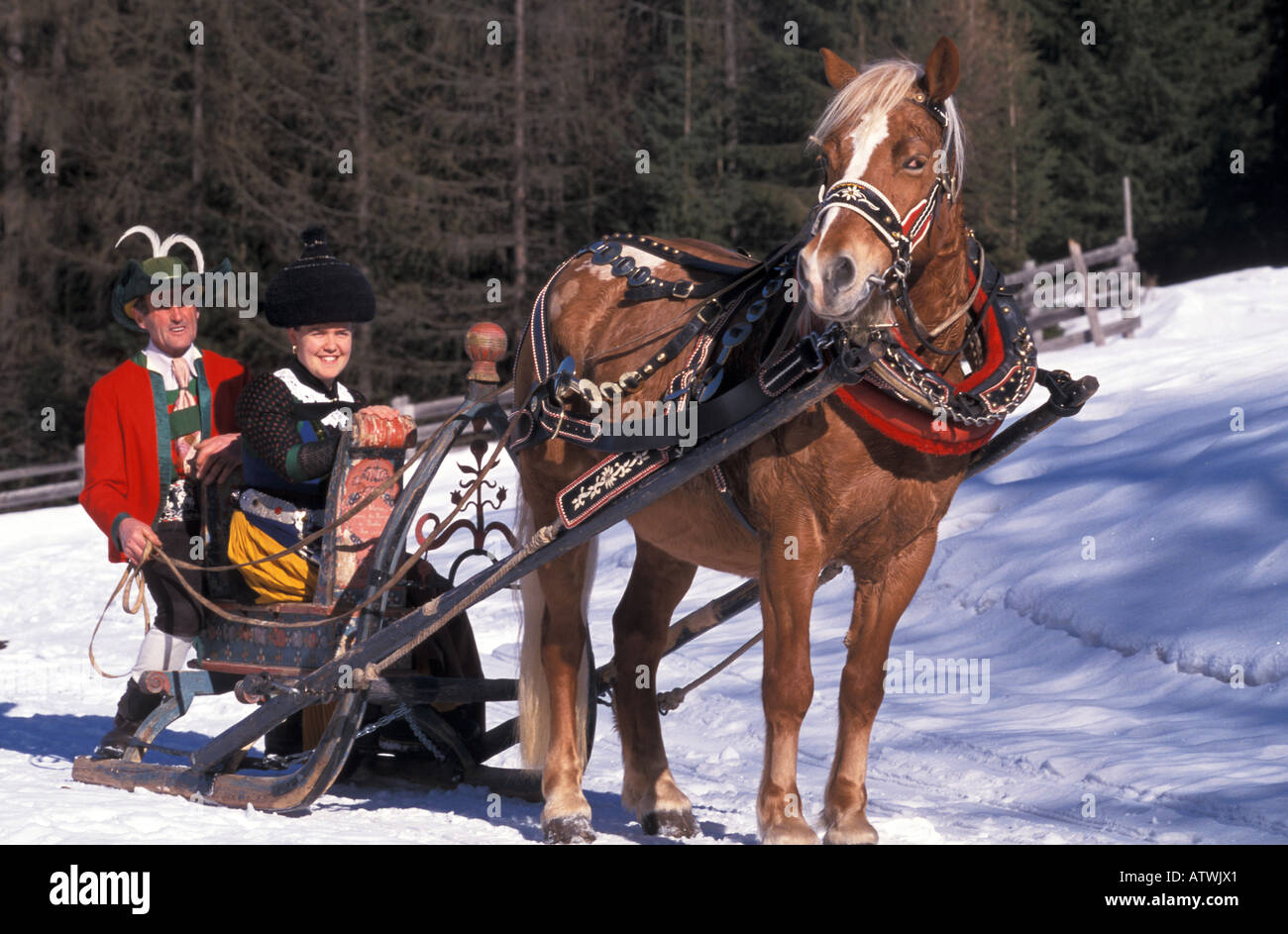 Typical costumes and antique sleigh Alta Badia Trentino Alto Adige Italy Stock Photo