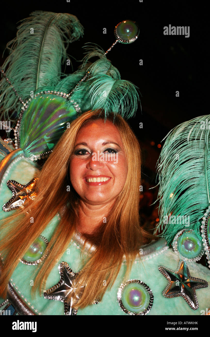 Close up portrait of smiling carnival dancer lady in green costume, Rio de Janeiro, Brazil, South America Stock Photo