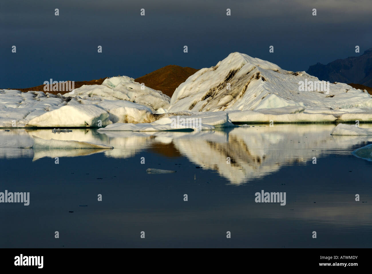 Icebergs floating in the glacial lagoon at sunset Jokulsarlon ...