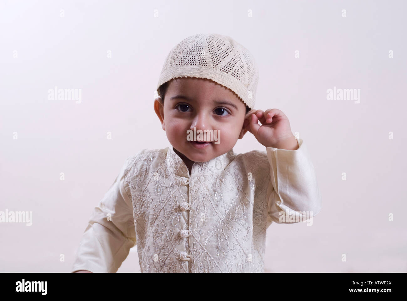Muslim baby wearing traditional Islamic clothing smiling Stock ...
