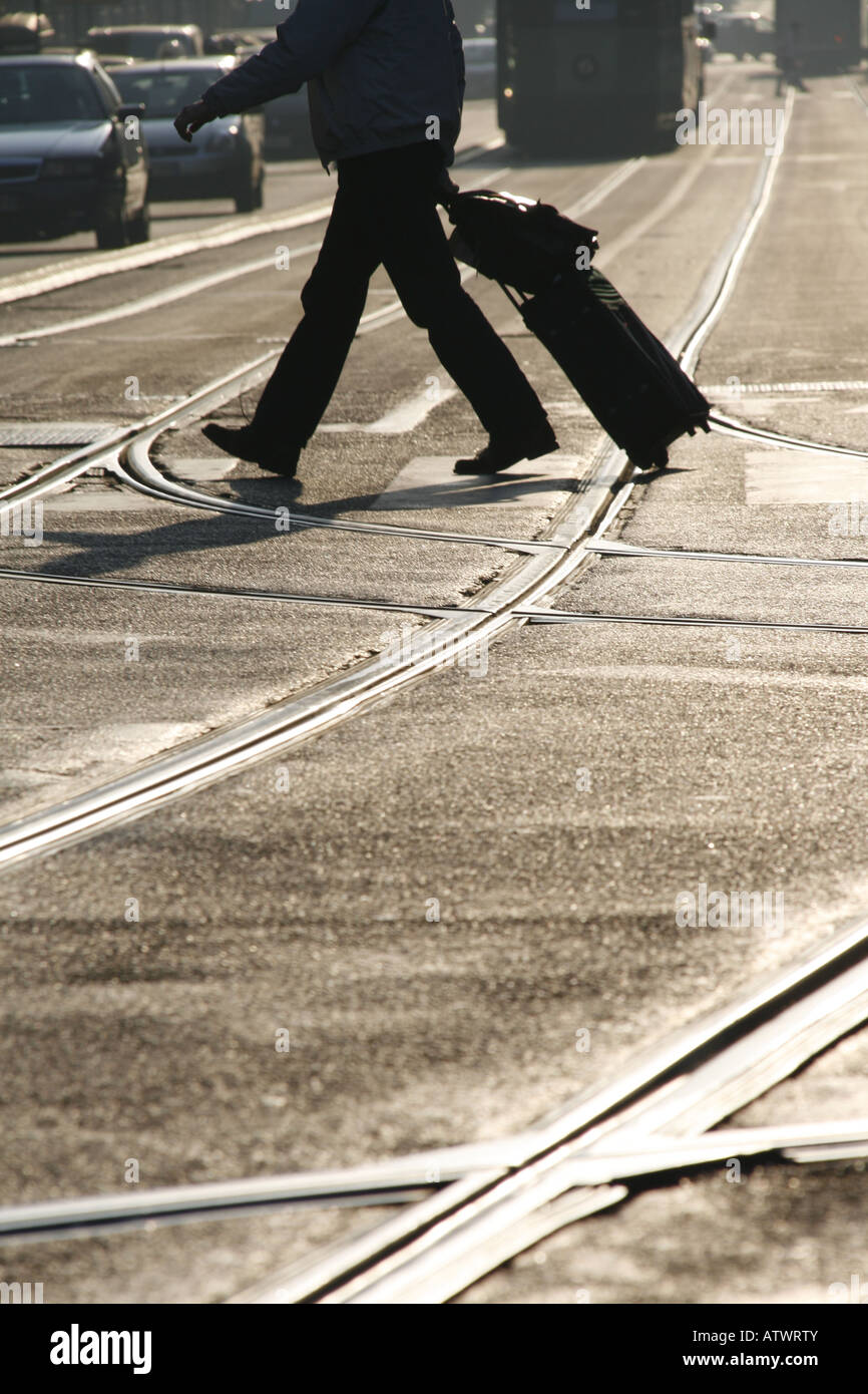 person with luggage in town Stock Photo Alamy