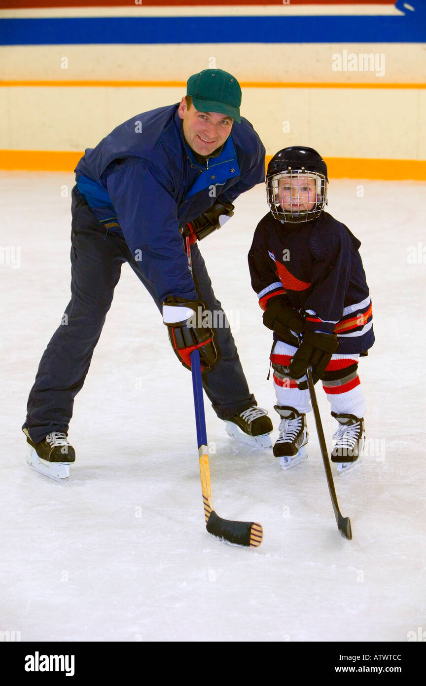 A coach and young hockey player Stock Photo Alamy