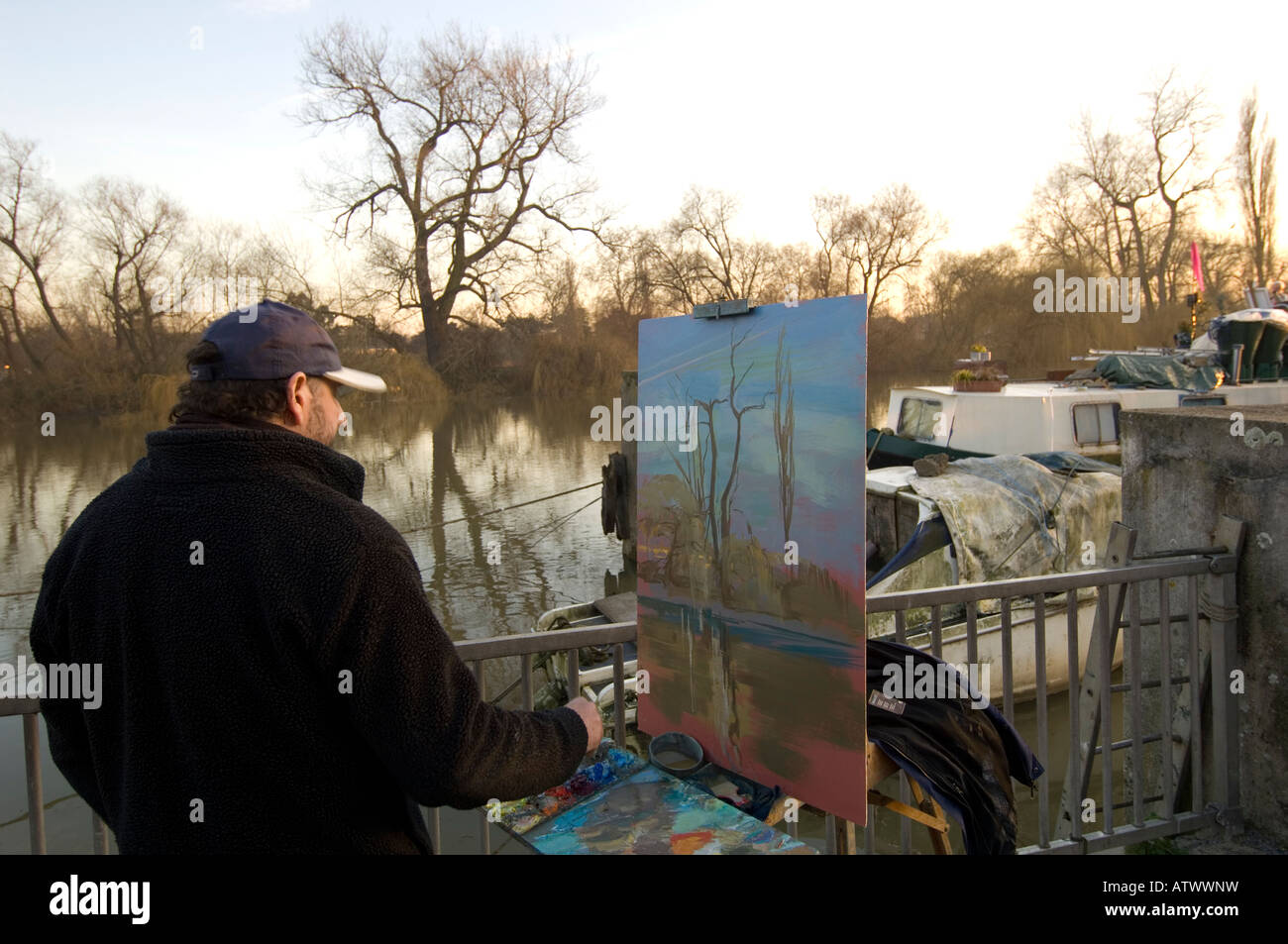 Artist painting by River Thames Brentford TW8 London United Kingdom Stock Photo
