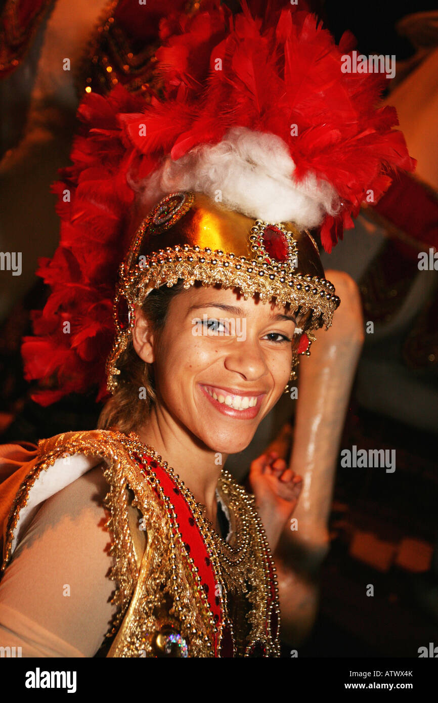Close up portrait of smiling lady carnival dancer in red head dress costume, Rio de Janeiro, Brazil, South America Stock Photo