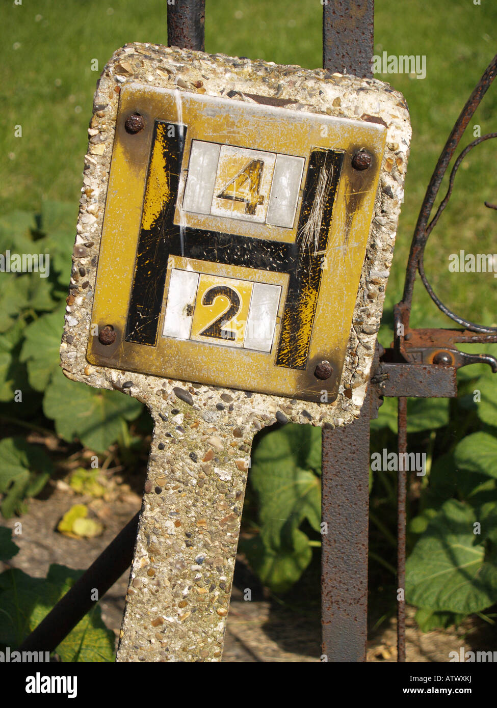 old concrete fire water hydrant location sign Stock Photo - Alamy