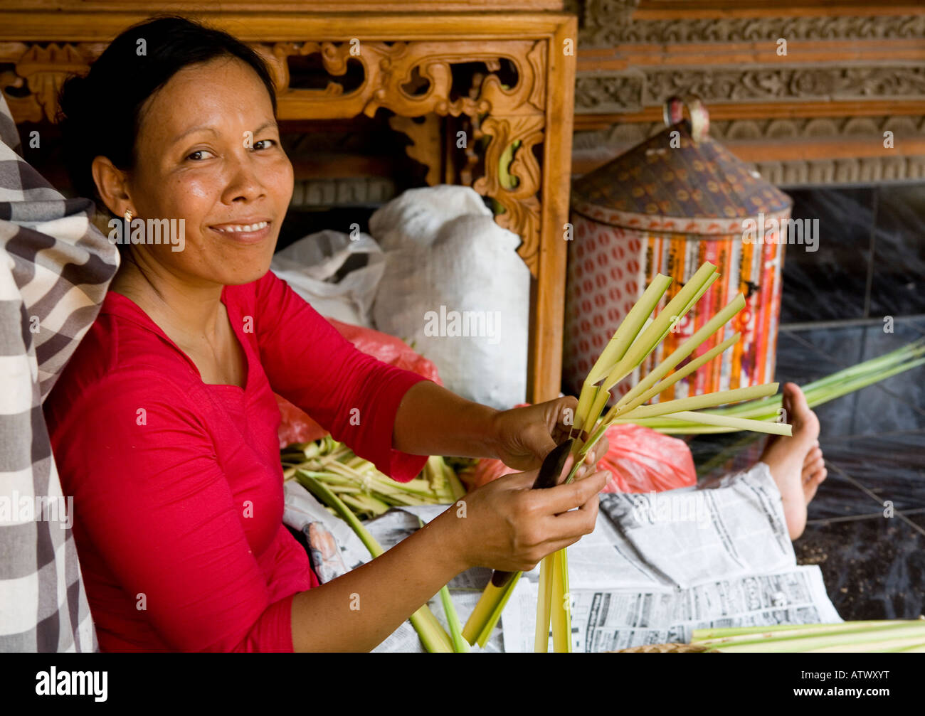 Local Women Preparing Votive Offerings For the Temple Ubud Bali Indonesia Stock Photo