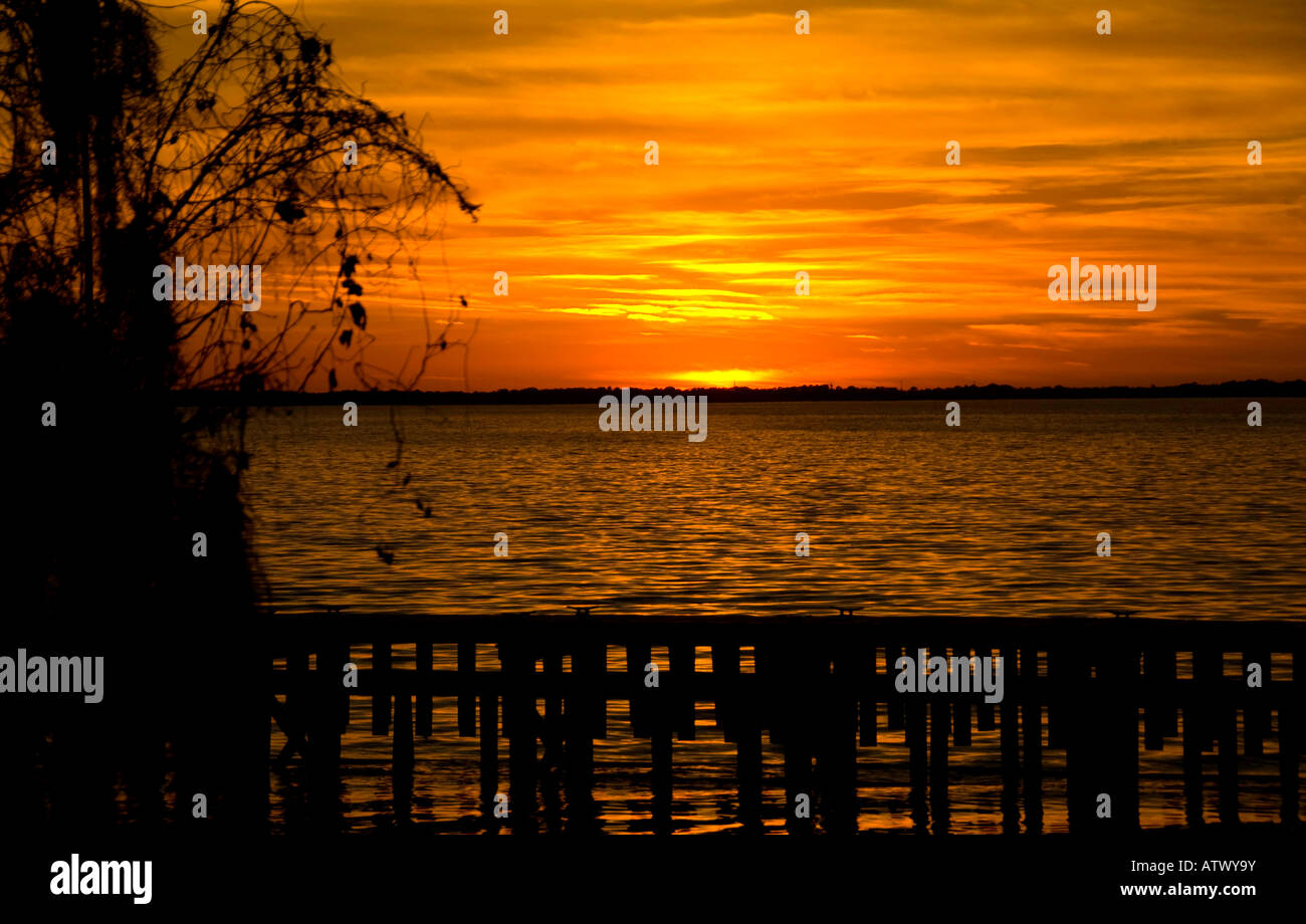Central Florida sunset over lake and canoe rack Stock Photo - Alamy