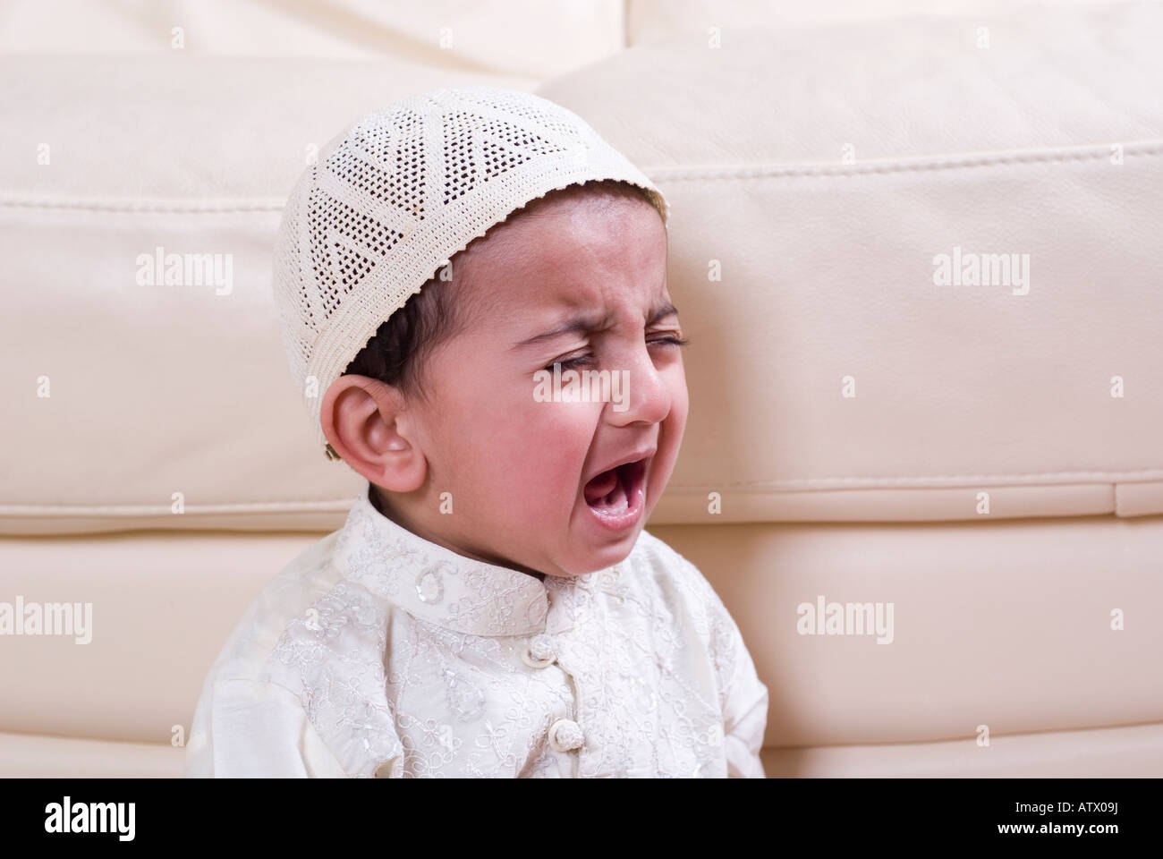 Muslim baby crying Stock Photo - Alamy