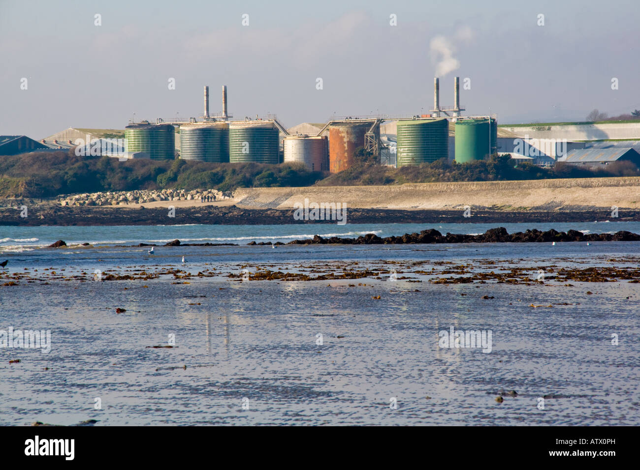 China Clay works at Par Cornwall England seen from the beach Stock