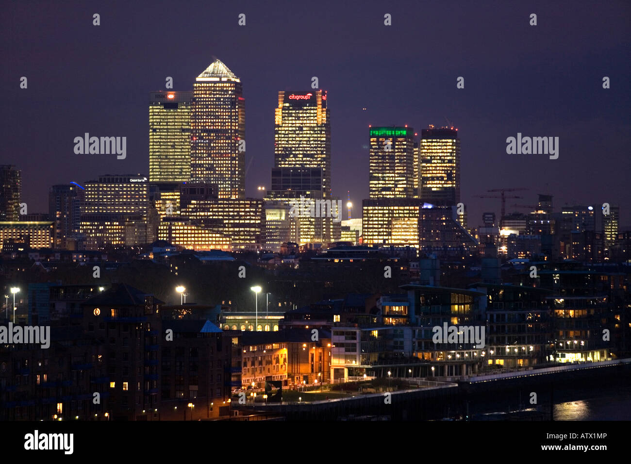 Docklands and Canary Wharf seen at night. London. UK Stock Photo