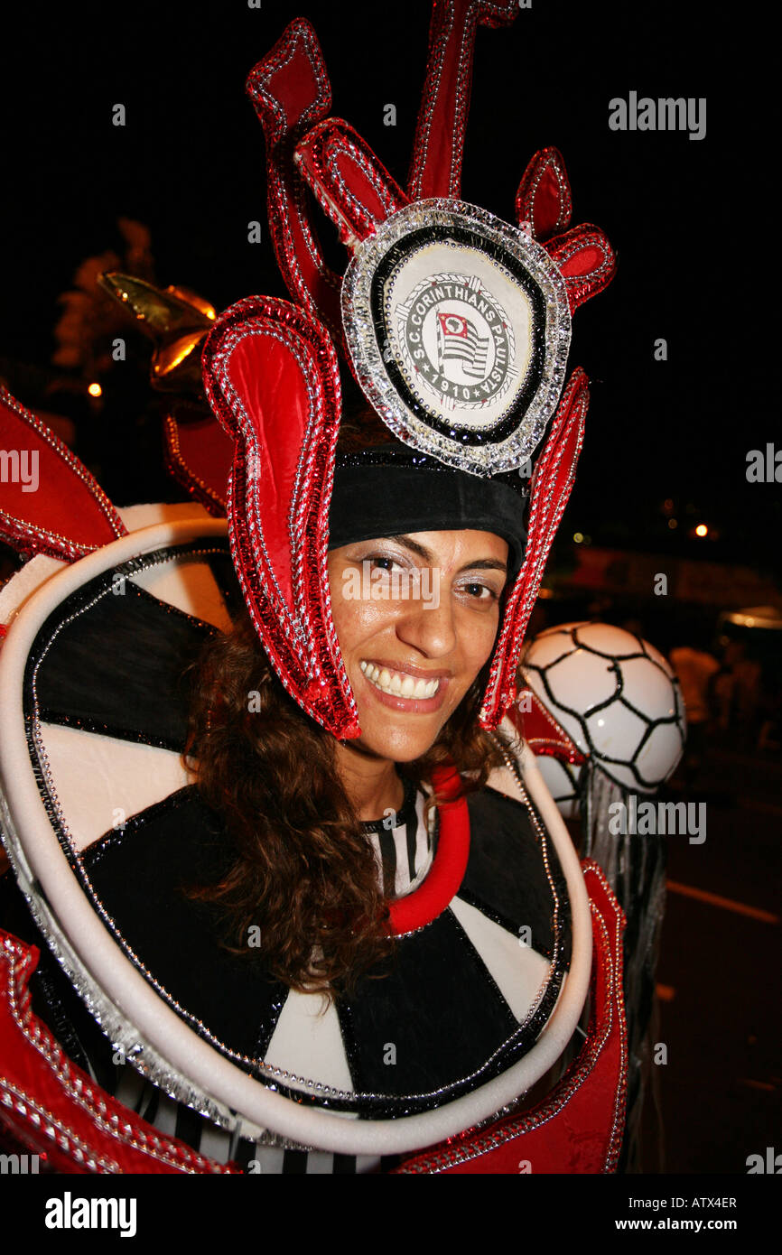 Close up portrait of smiling carnival dancer in red, white and black head dress costume, Rio de Janeiro, Brazil, South America Stock Photo