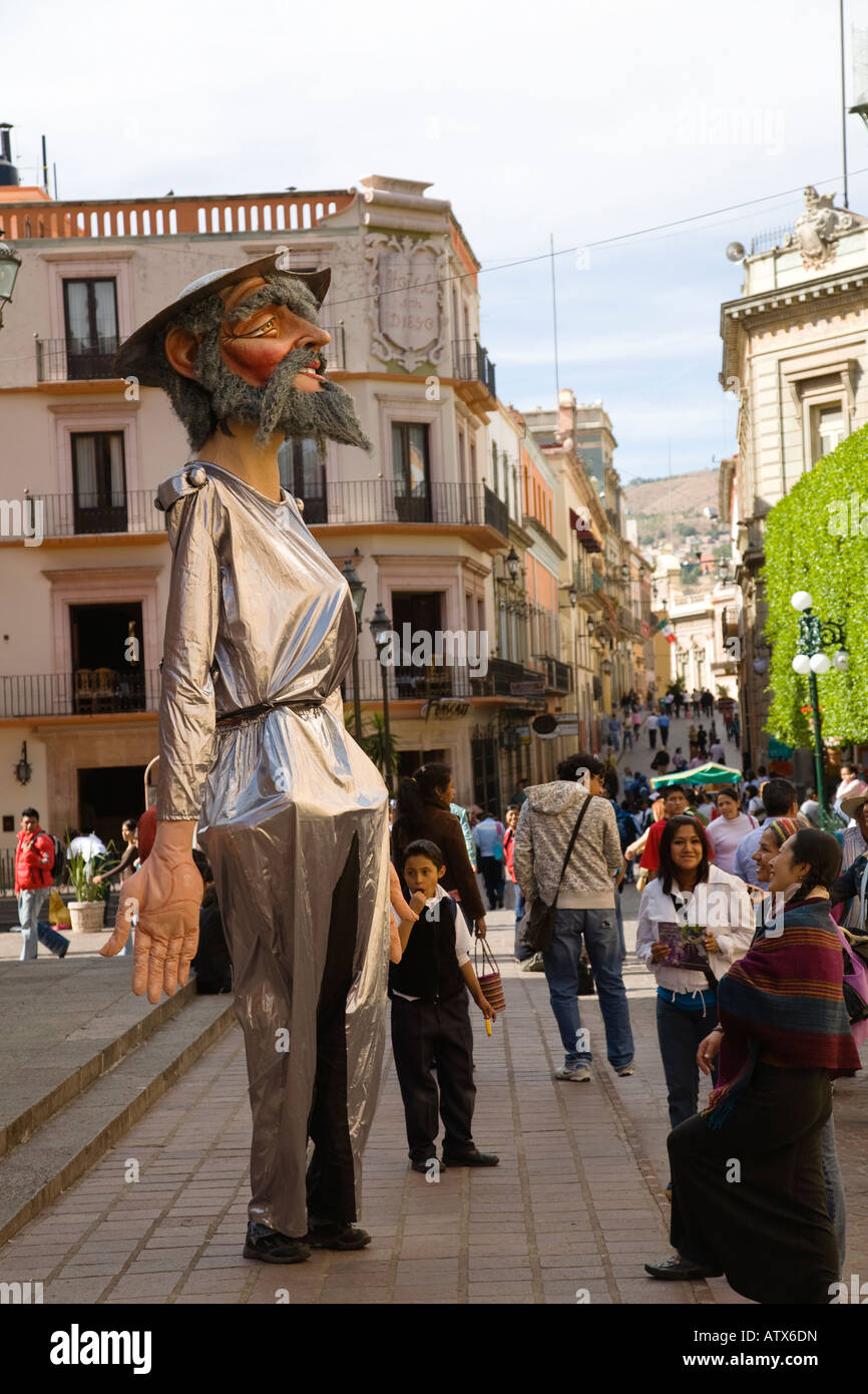 MEXICO Guanajuato Man in tall Don Quixote costume standing on street talking with visitors on sidewalk Stock Photo