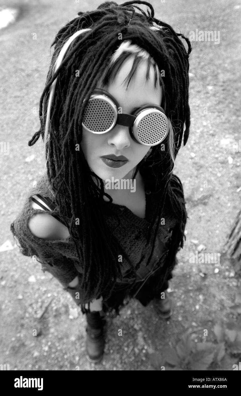 Black and white wide angle portrait of a goth wearing goggles Stock Photo