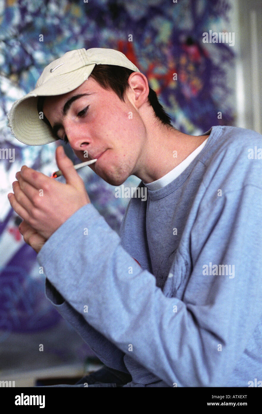 Teenager smoking a spliff. Stock Photo