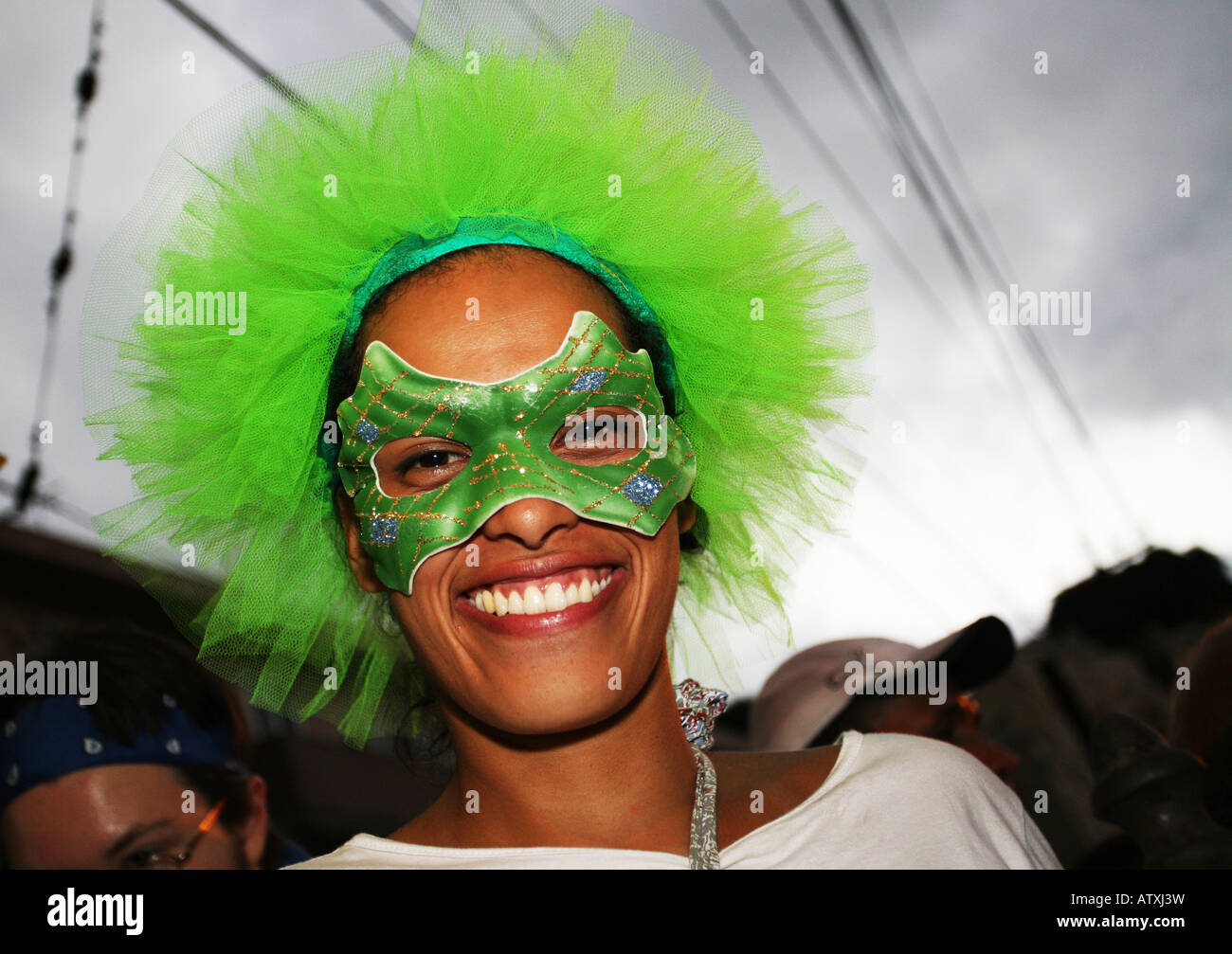 Close up portrait of beautiful woman in fancy dress costume mask and wig at Santa Teresa street bloco carnival, Rio de Janeiro Stock Photo