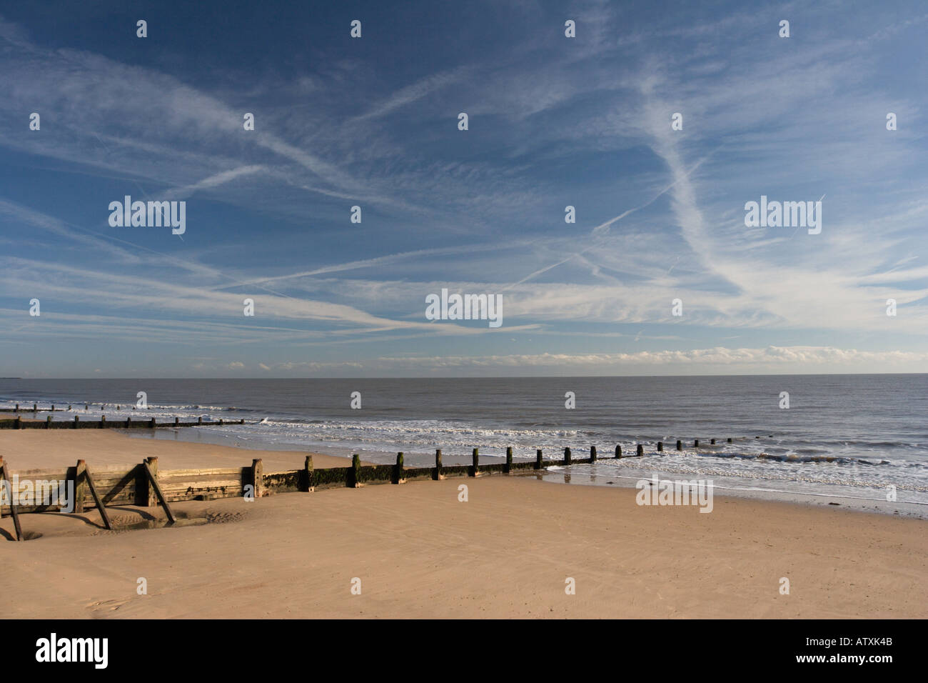 Frinton on sea beach with groynes protecting from sand erosion Stock Photo