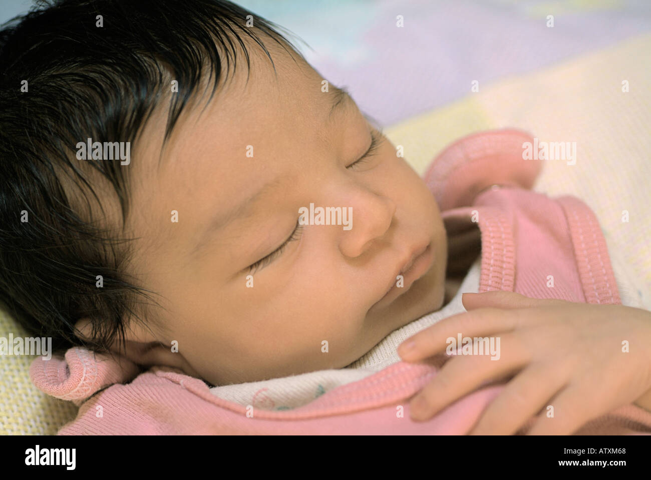Sleeping newborn baby girl. Stock Photo