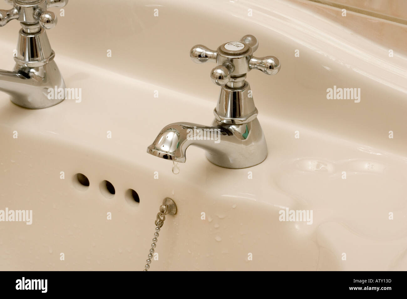 Bathroom tap left dripping Stock Photo Alamy